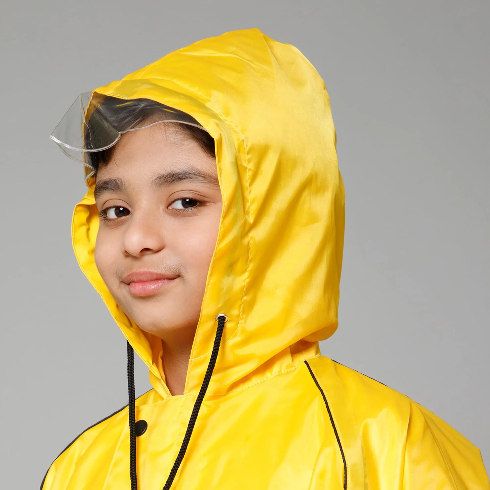 THE CLOWNFISH Duke Series Kids Waterproof Polyester Double Coating Reversible Raincoat with Hood and Reflector Logo at Back. Set of Top and Bottom. Printed Plastic Pouch. Kid Age-5-7 years (Yellow)