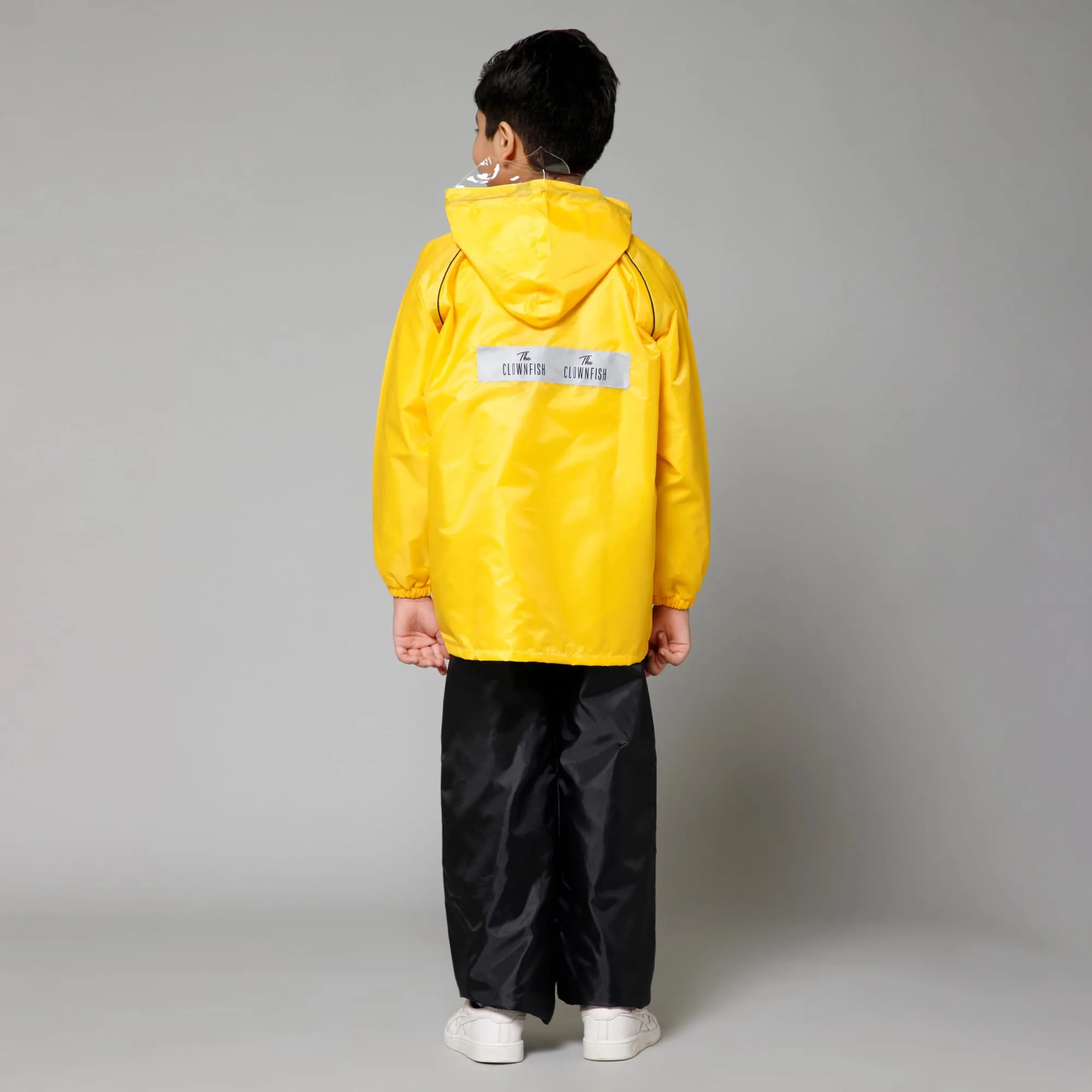 THE CLOWNFISH Duke Series Kids Waterproof Polyester Double Coating Reversible Raincoat with Hood and Reflector Logo at Back. Set of Top and Bottom. Printed Plastic Pouch. Kid Age-5-7 years (Yellow)